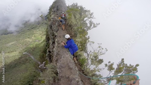 Going by the crest of the mountain to reach the 3 Salazes, between the cirques of Mafate and Cilaos in Reunion Island. photo
