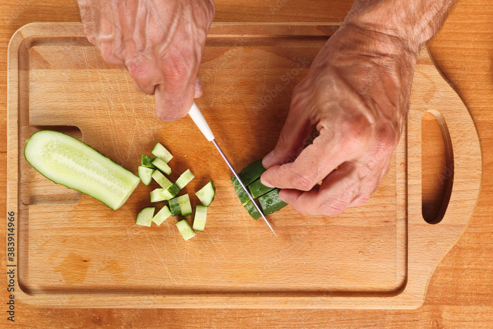 Dicing cucumber. Directly Above.