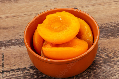 Marinated peaches fruit in the bowl