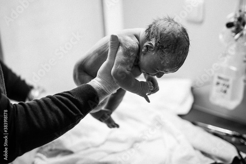 Tableau sur toile Newborn child seconds and minutes after birth