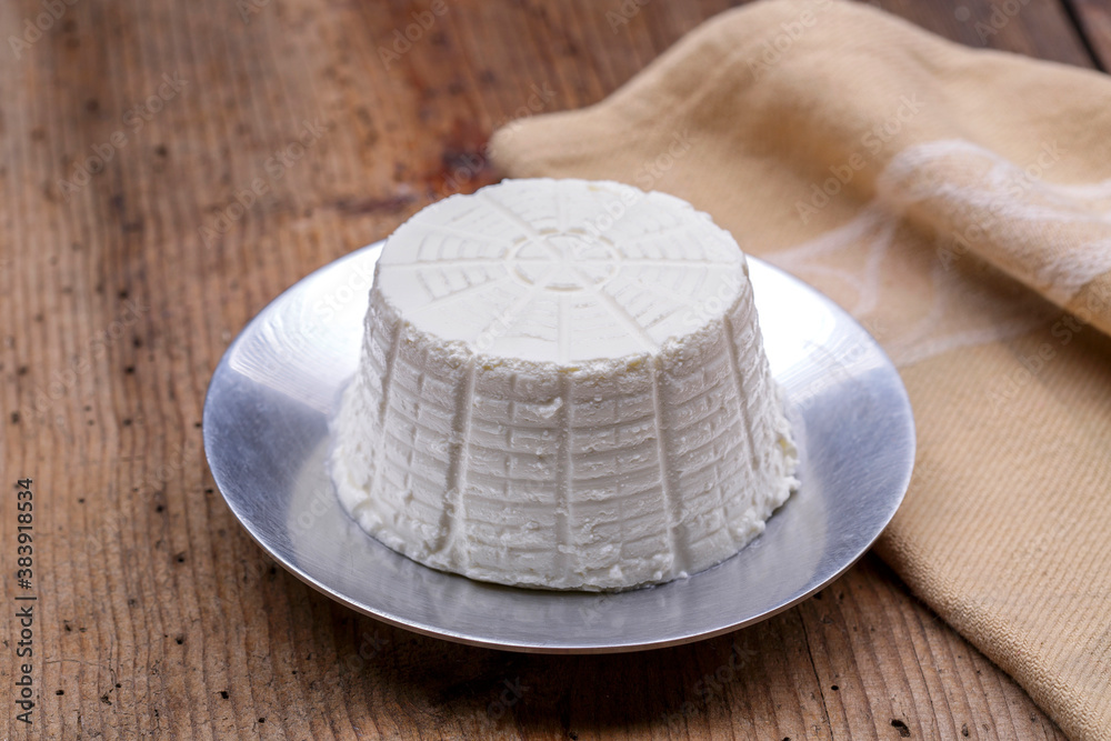 Ricotta cheese on wood background Ricotta cheese on wood background