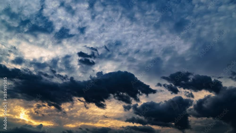 beautiful sunset sky, bright sun and dark silhouette of clouds as a background beautiful sunset sky, bright sun and dark silhouette of clouds as a background
