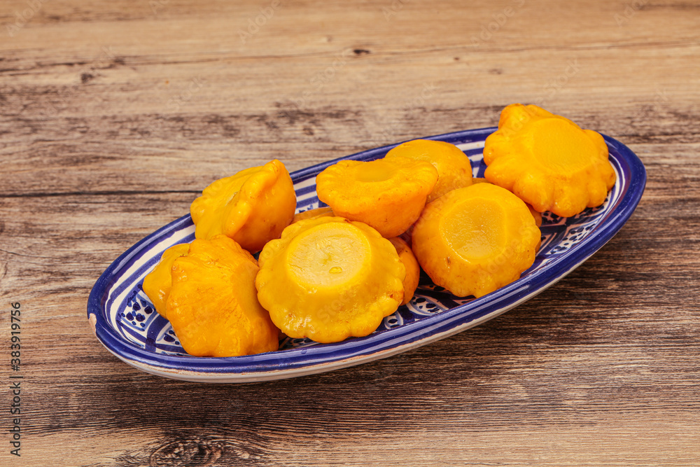 Marinated yellow patisson in the bowl