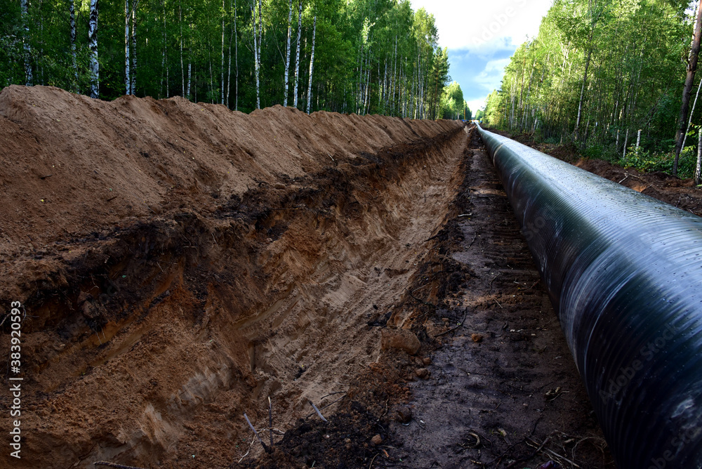 Crude oil and Natural gas pipeline construction work in forest area ...