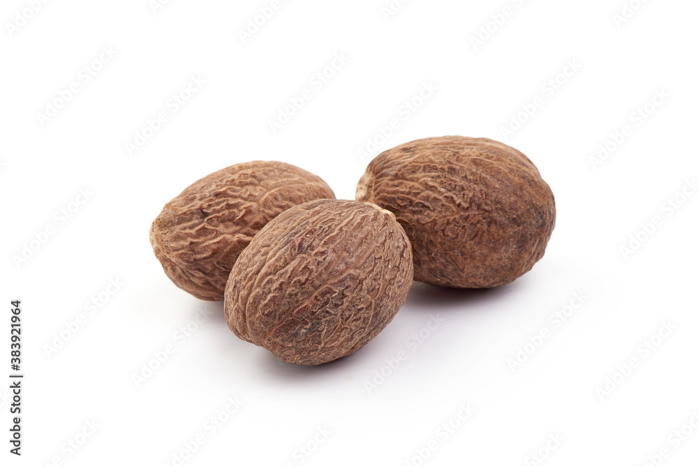 Fresh Nutmeg. Whole nuts, close-up, isolated on white background Fresh Nutmeg. Whole nuts, close-up, isolated on white background