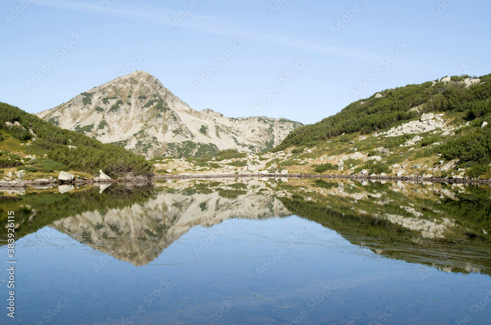Muratov peak and its reflection in Banderishko Frog lake in the Pirin National Park, Bulgaria