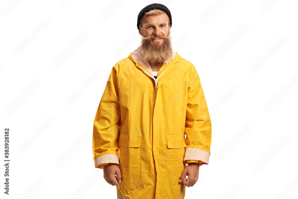 Fototapeta premium Bearded fisherman with a yellow rain coat smiling