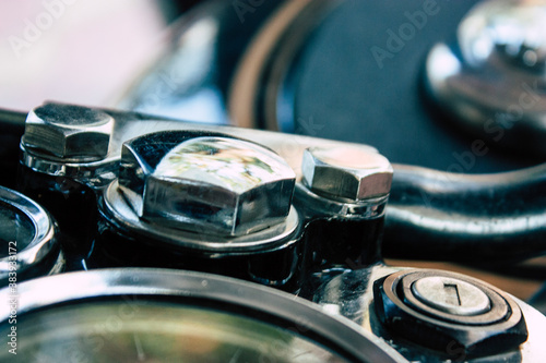 Closeup of a motorcycle parked in the streets of the city center of the metropolitan area
 photo