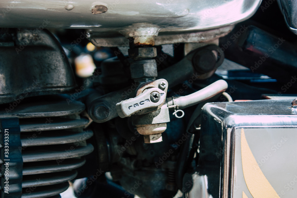 Closeup of a motorcycle parked in the streets of the city center of the metropolitan area
