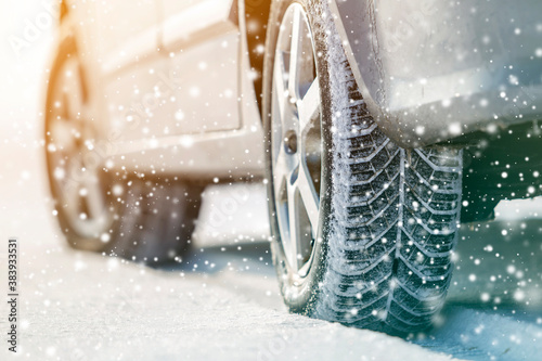 Schilderij op canvas Close-up of car wheels rubber tires in deep winter snow