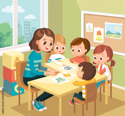 Cute children kids learning new words with flash cards in the class at primary school, pre-school. Teacher teaches kids babies new words. Art classroom interior with pupils. Teacher with pupils.