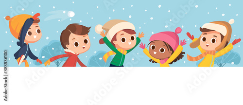 Children having fun goofing around outdoors and having snowball fight during snowfall. Winter background. Kids jumping, running and throwing a snowball.