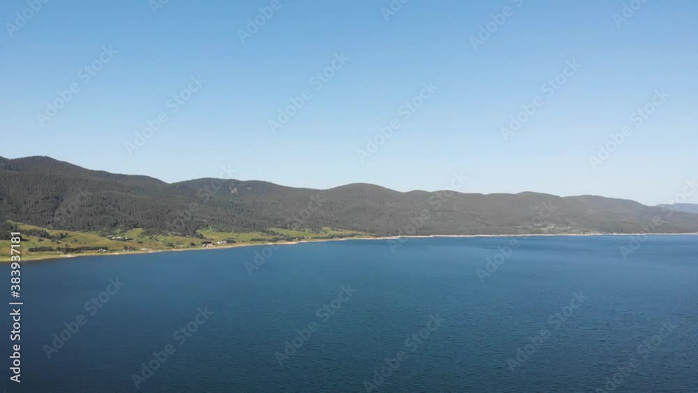 Aerial view from high mountain dam located in Bulgaria Aerial view from high mountain dam located in Bulgaria