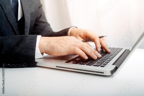 businesswoman hand using smart phone, tablet payments and holding credit card online shopping, omni channel, digital tablet docking keyboard computer at office in sun light