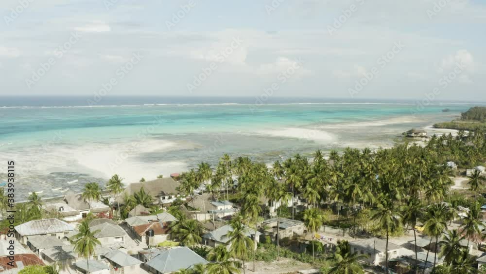 Aerial view Zanzibar Tanzania. Drone video of a sandy beach with diamonds and houses on the shoreline by the ocean with blue water and waves.
Aerial view Zanzibar Tanzania. Drone video of a sandy beach with diamonds and houses on the shoreline by the ocean with blue water and waves.