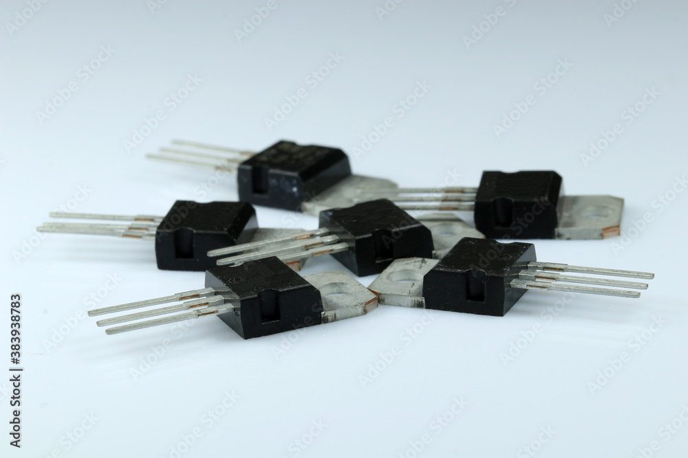 Big power transistors on white background. Electronic components. Big power transistors on white background. Electronic components.