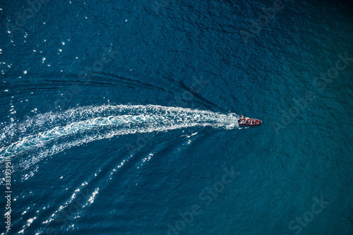 Above view of motorboat with wake in the sea photo