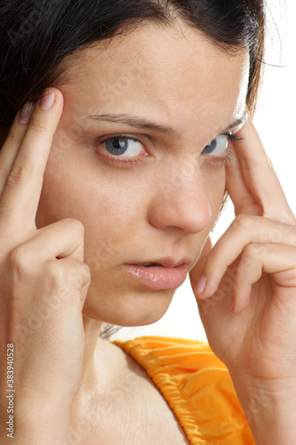 a young woman has a painfull headache