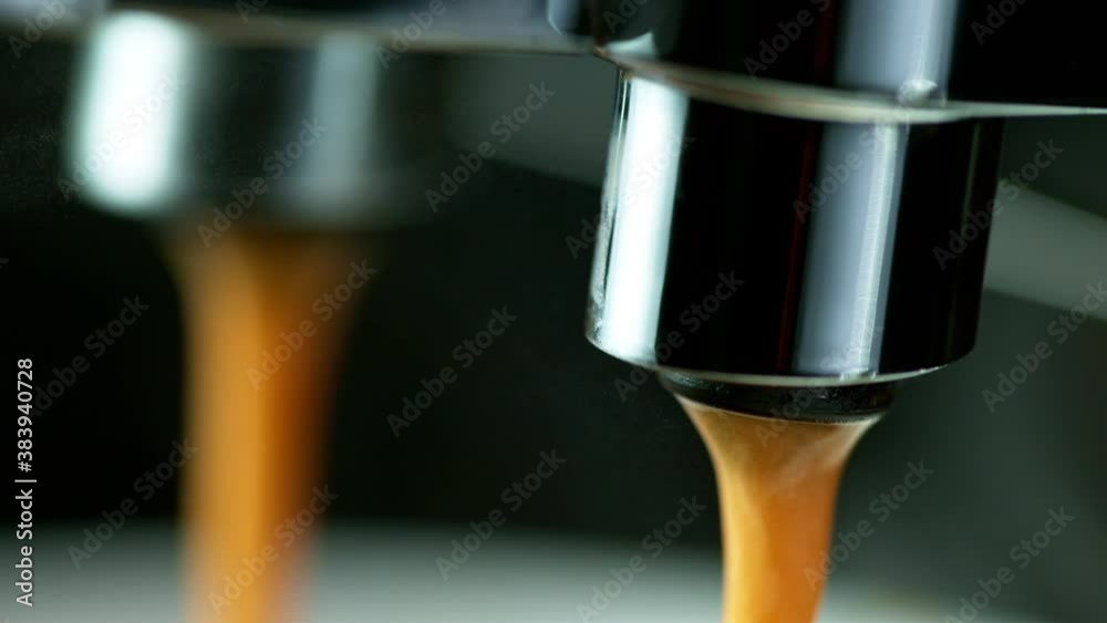 Close-up Slow Motion of Espresso Pouring from Coffee Machine. Filmed on High Speed Cinematic Camera at 1000 fps. Close-up Slow Motion of Espresso Pouring from Coffee Machine. Filmed on High Speed Cinematic Camera at 1000 fps.