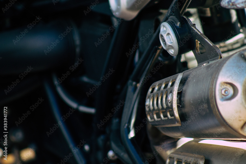 Closeup of a motorcycle parked in the streets of the city center of the metropolitan area
