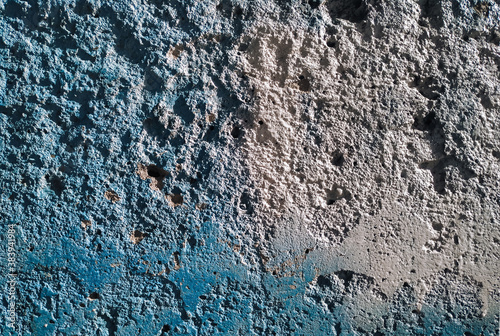 Texture of old cement wall with traces of blue grunge paint.