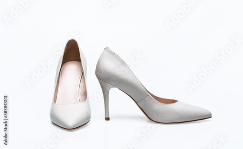 Fashionable women shoes isolated on white background. White high heel women shoes on white background. Stylish classic women leather shoe
