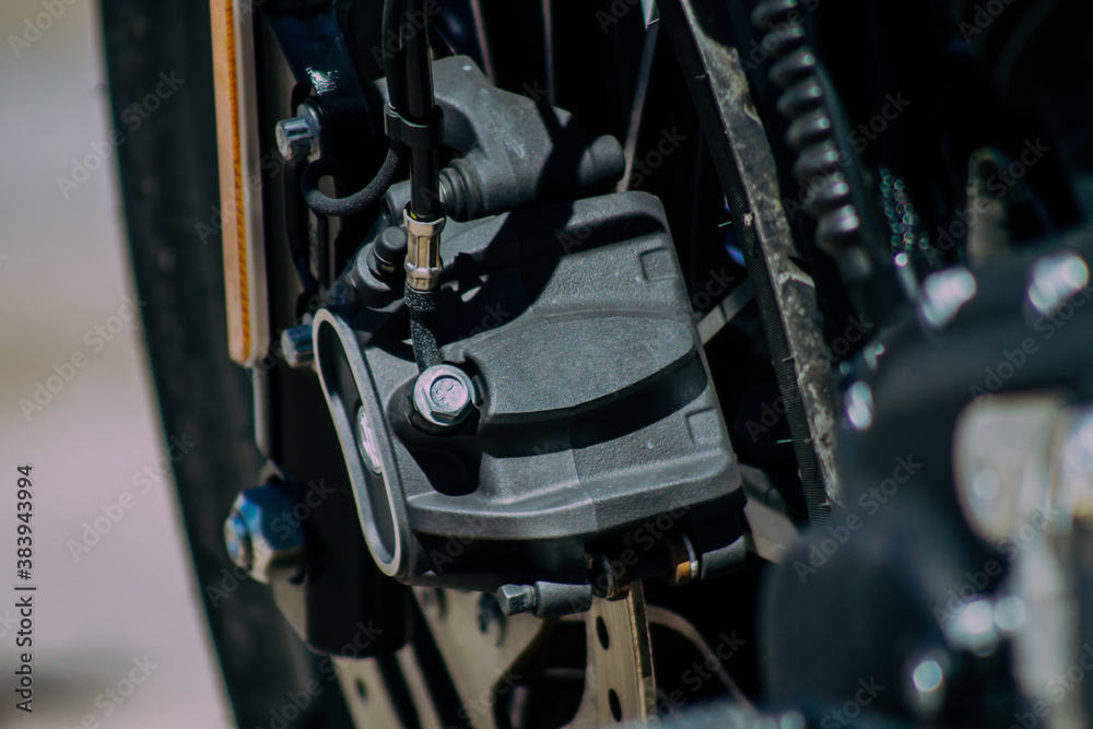 Fototapeta premium Closeup of a motorcycle parked in the streets of the city center of the metropolitan area 