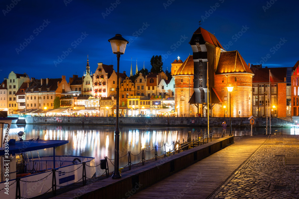 Fototapeta premium Historical Port Crane over the Motlawa river in Gdansk at dusk, Poland