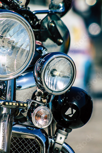 Closeup of a motorcycle parked in the streets of the city center of the metropolitan area
