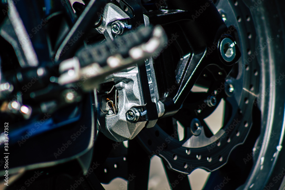Closeup of a motorcycle parked in the streets of the city center of the metropolitan area

