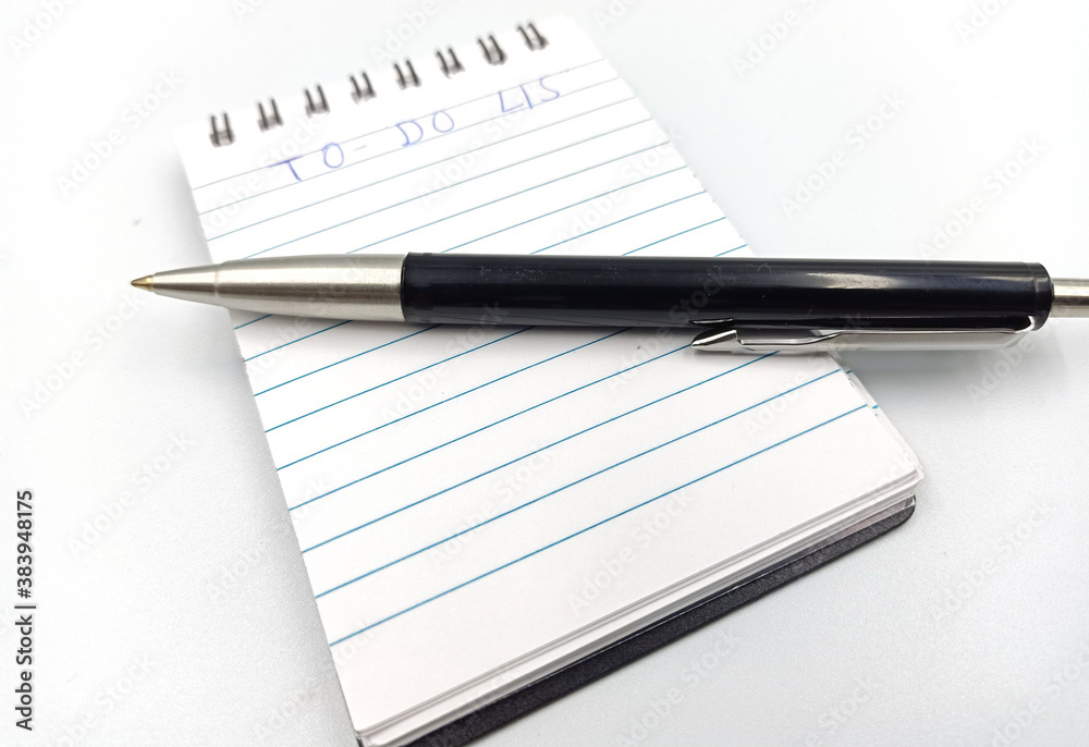 notebook with to do list on white background, planning and design concept notebook with to do list on white background, planning and design concept