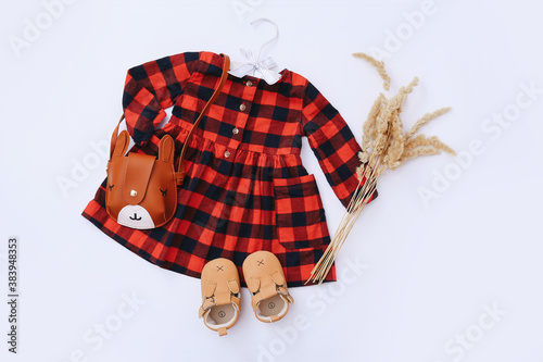 Fashion trendy look of baby girl clothes and toy stuff. Baby fashion concept