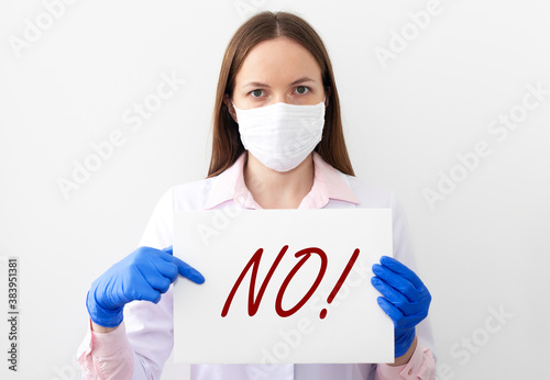no sign word in doctor hands. Negative answer concept. No risk, no illness, no virus photo