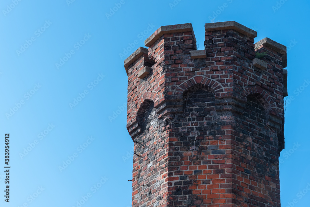 Medieval tower against a clear sky.