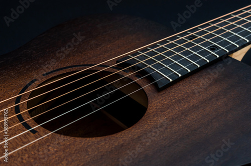 Wooden classical acoustic guitar. Close up.