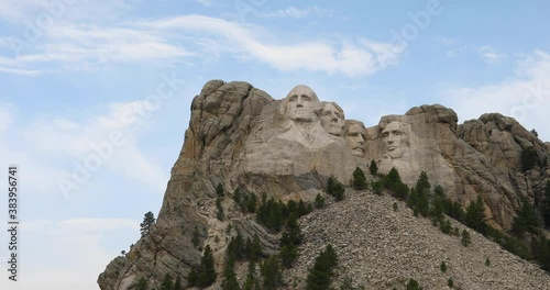 Mount Rushmore president mountain monument pan 4K. National Memorial a colossal sculpture carved into granite in the Black Hills South Dakota. President  Washington, Lincoln, Jefferson Roosevelt. photo