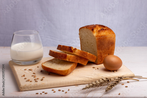 white bread with milk and an egg on a cutting board