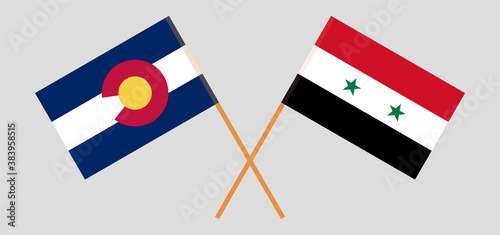 Crossed flags of The State of Colorado and Syria