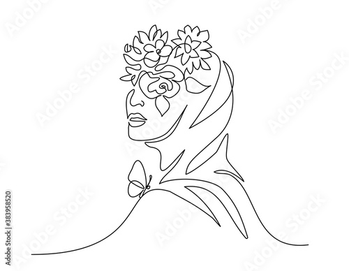 Young happy woman in hijab with flowers on her face