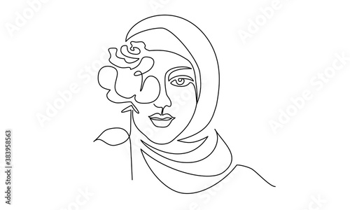 Young happy woman in hijab with flowers on her face