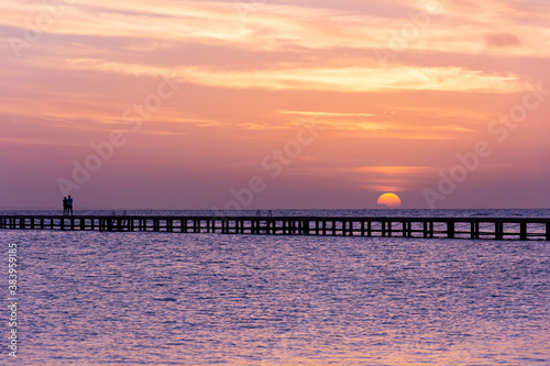  sunset or sunrise  with a beautiful sky with clouds  on a deserted tropical beach