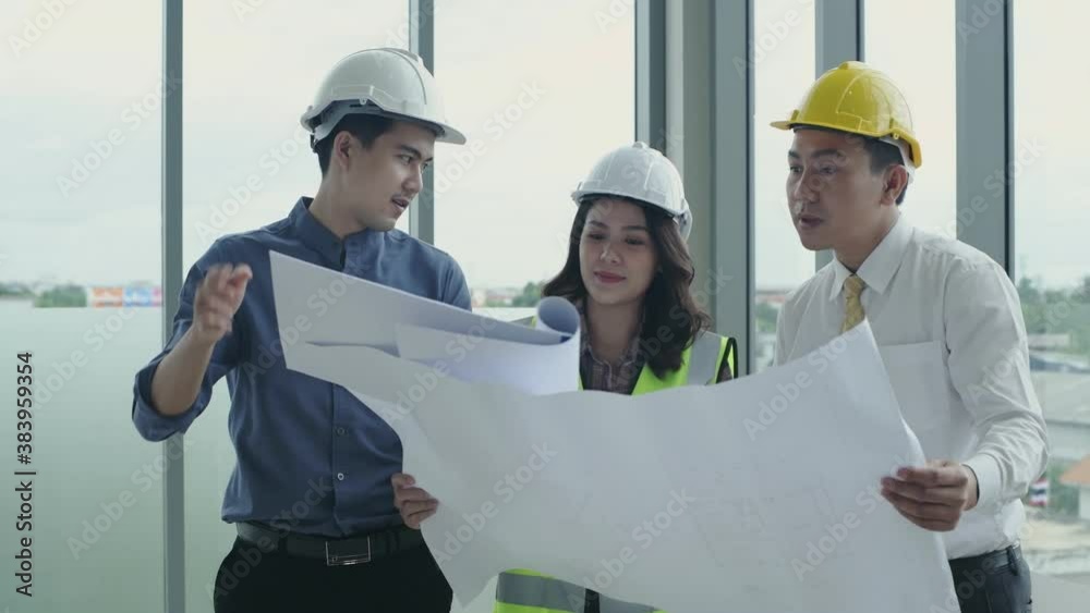Business concept. Engineers are actively planning the work together. 4k Resolution. Business concept. Engineers are actively planning the work together. 4k Resolution.