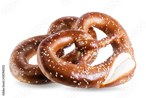 Pretzel with salt and sesame seeds on a white isolated background