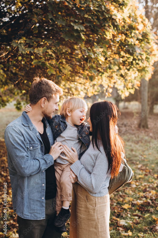 Family playing in autumn park having fun. Family playing in autumn park having fun.