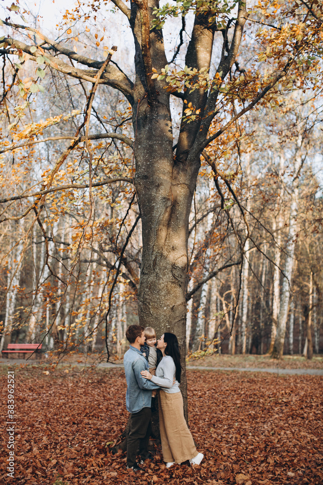happy family mother father and baby on autumn walk in the park happy family mother father and baby on autumn walk in the park