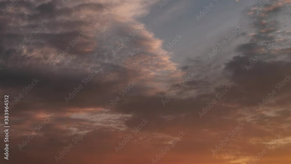 Corrugated clouds flying in the sky at sunset, slightly blurred Corrugated clouds flying in the sky at sunset, slightly blurred