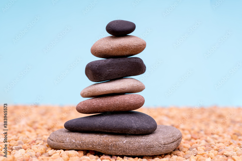 Stack of pebbles in an unstable state. A pyramid made of flat stones. Stack of pebbles in an unstable state. A pyramid made of flat stones.