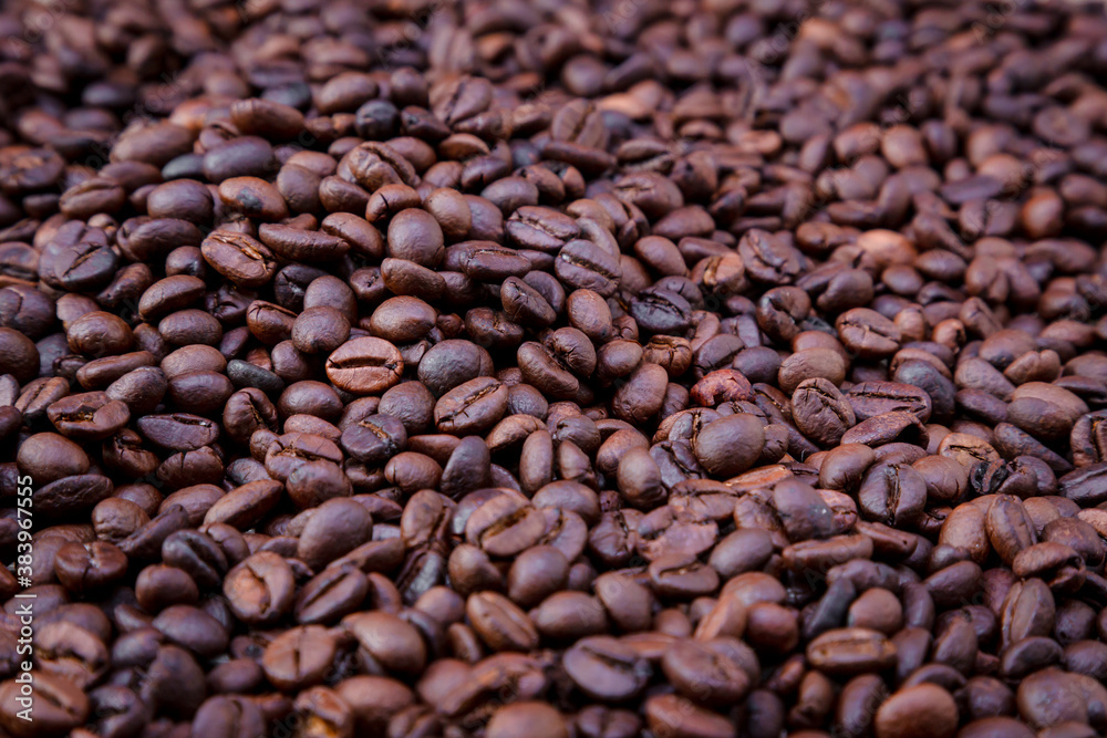Freshly roasted coffee beans background. Coffee beans background. Background of roasted coffee beans. Freshly roasted coffee beans background. Coffee beans background. Background of roasted coffee beans.