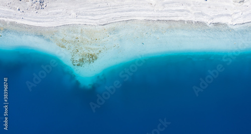 Amazing aerial landscape: top down view of beautiful white beach with turquoise water