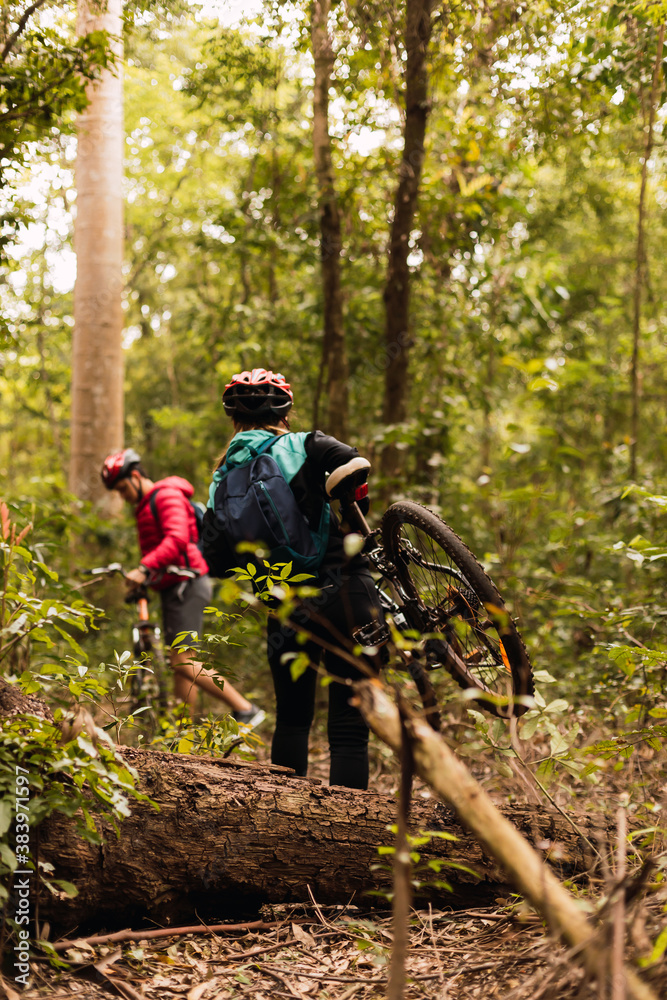 Bikers in the jungle. Closeup view of sportswear back. Outdoor and sport concept. Bikers in the jungle. Closeup view of sportswear back. Outdoor and sport concept.